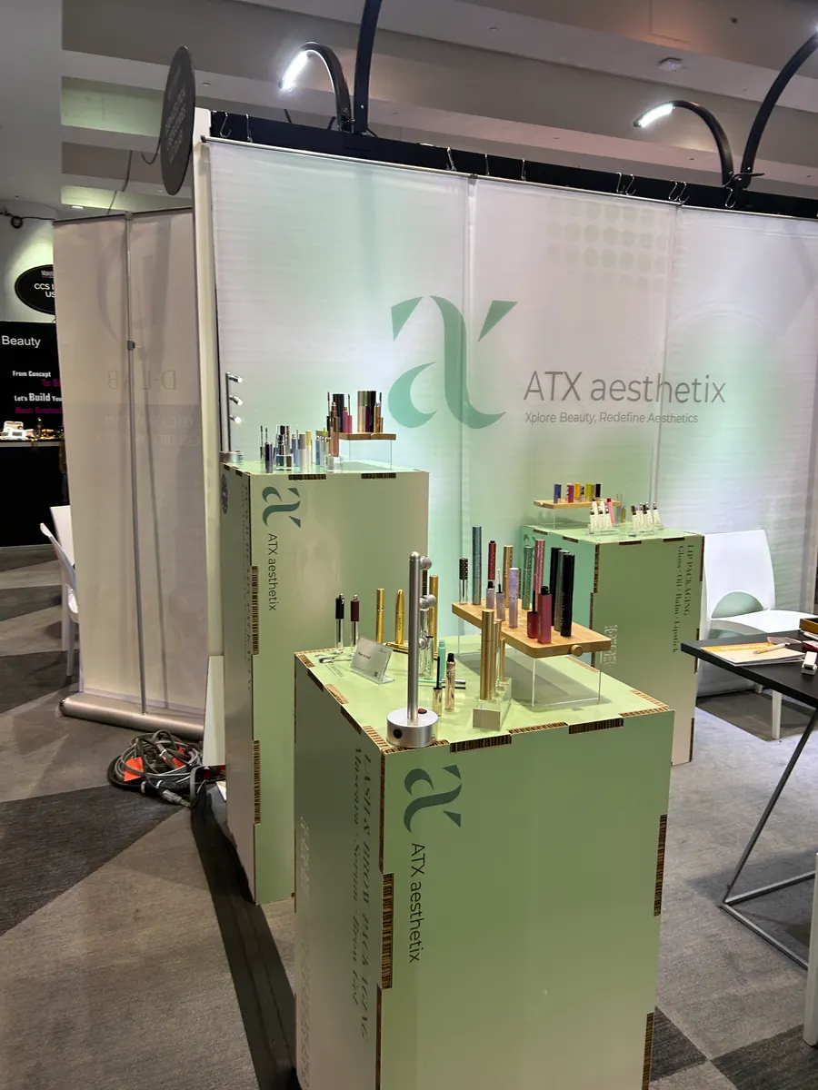 Honeycomb display plinths with products and a branded backdrop