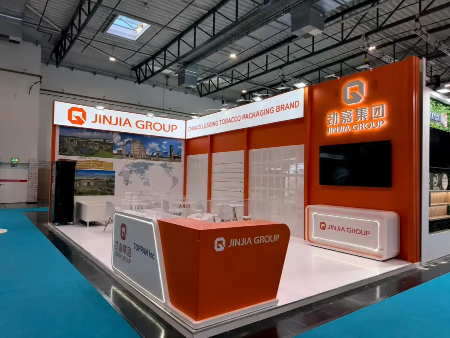 Orange stand with a broad canopy and meeting area